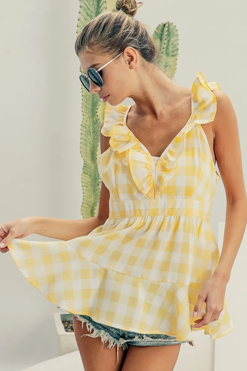 Ruffled neckline sleeveless check plaid peplum top.