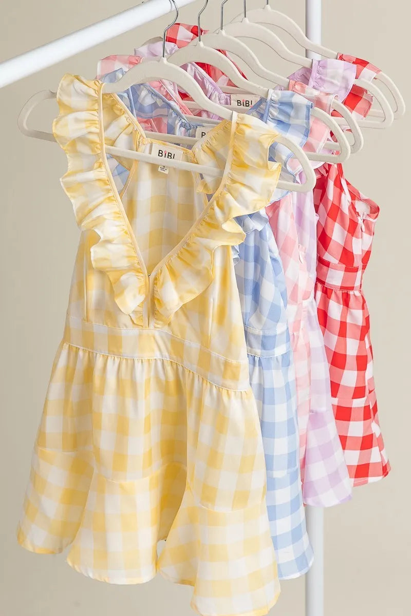 Ruffled neckline sleeveless check plaid peplum top.