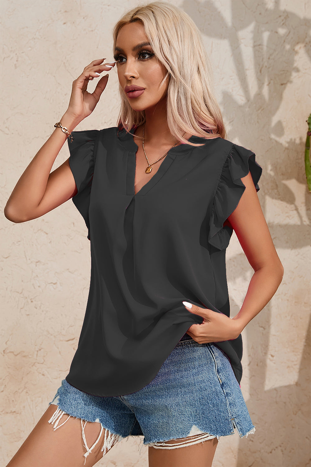 Ruffled Notched Cap Sleeve Blouse.