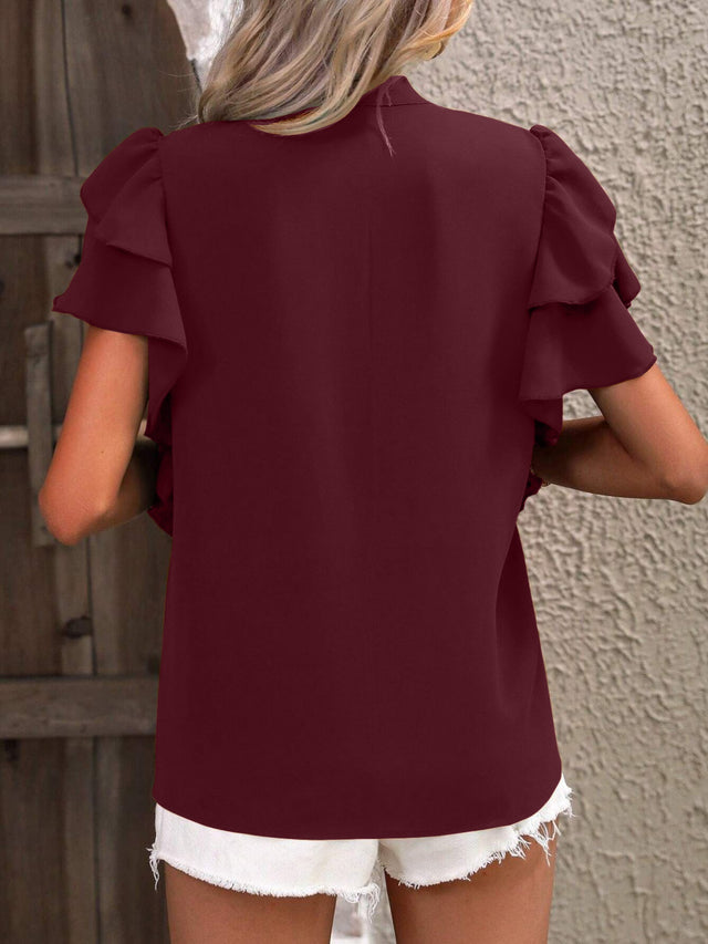 Ruffled Notched Short Sleeve Blouse.