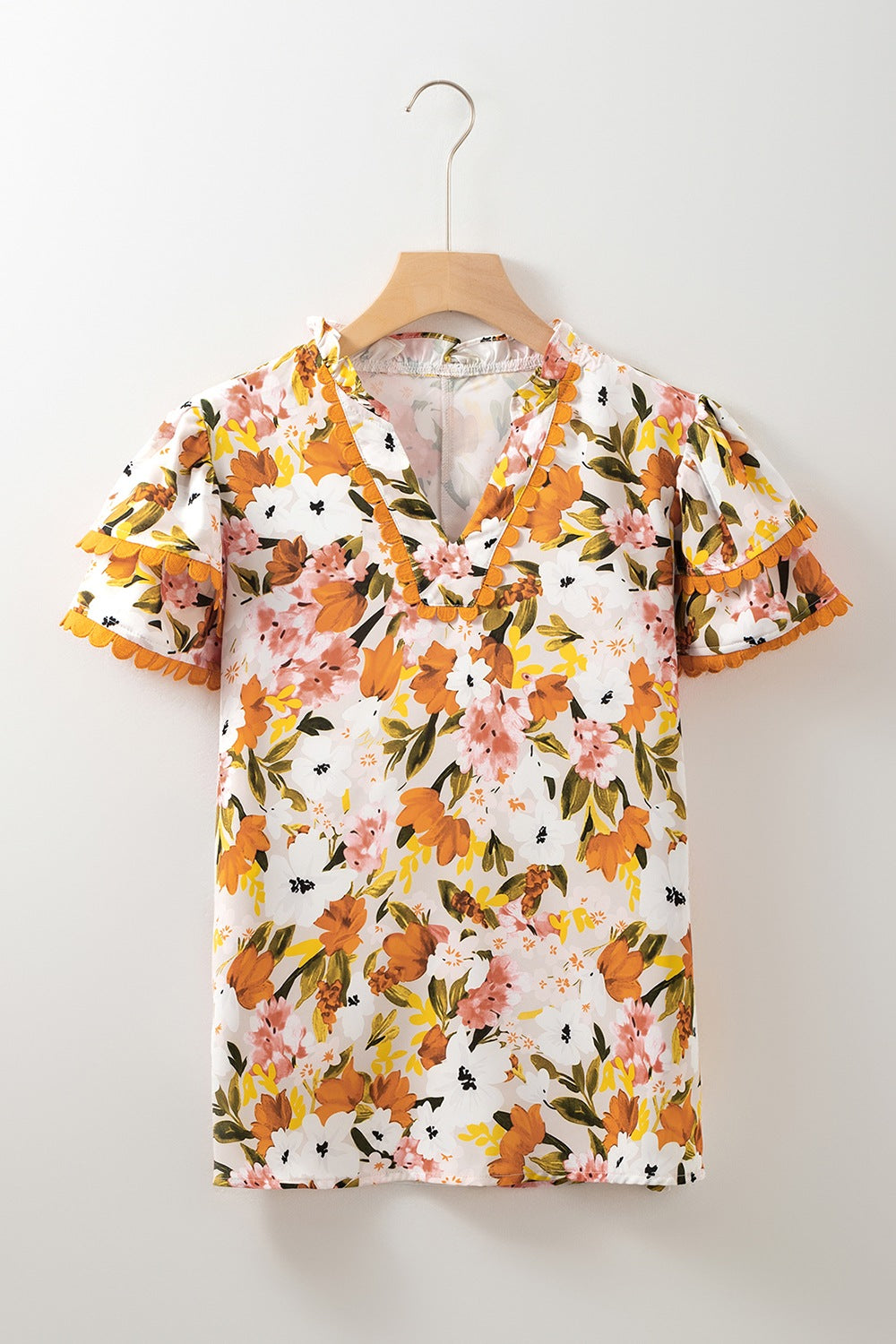 Ruffled Notched Short Sleeve Floral Blouse.