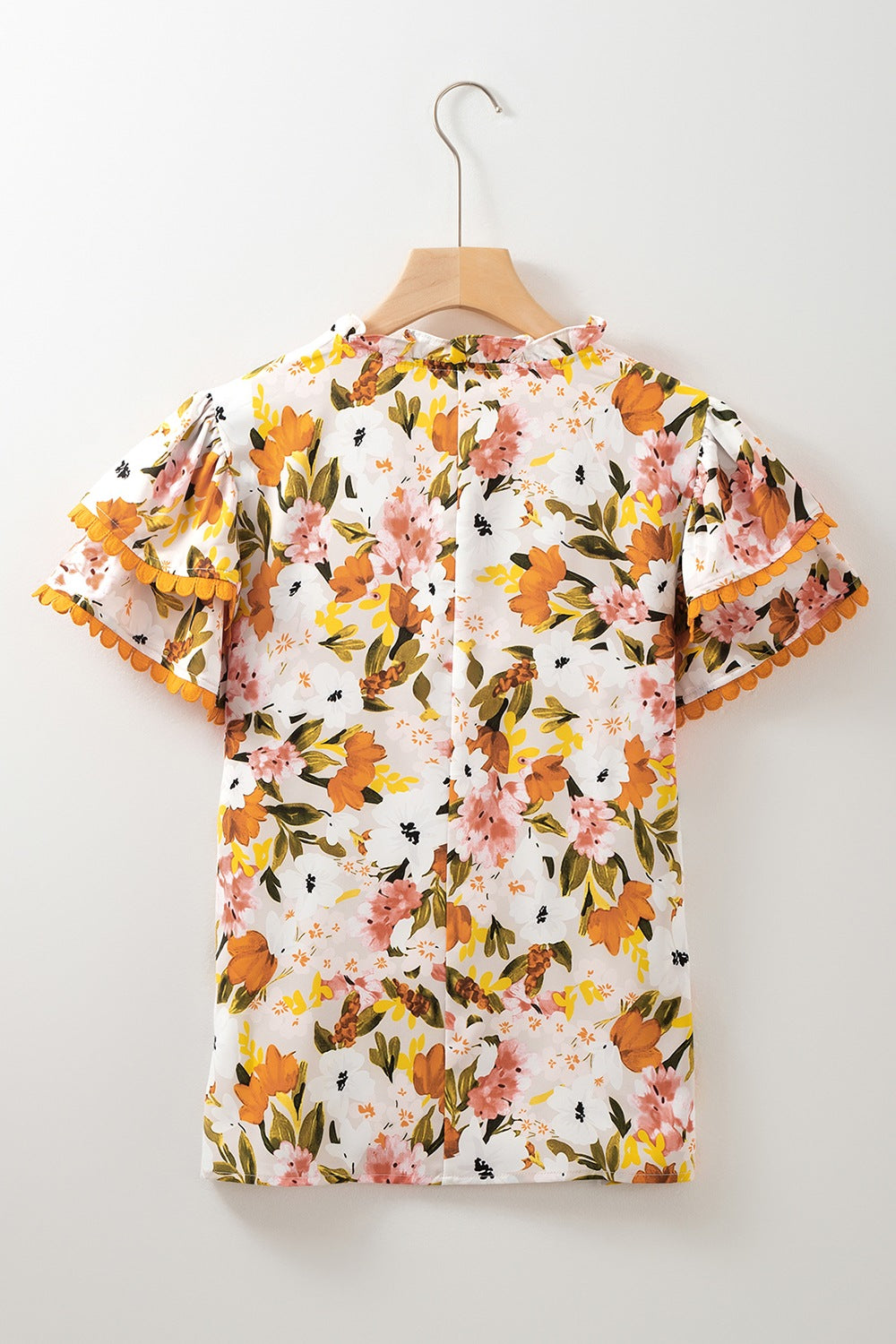 Ruffled Notched Short Sleeve Floral Blouse.