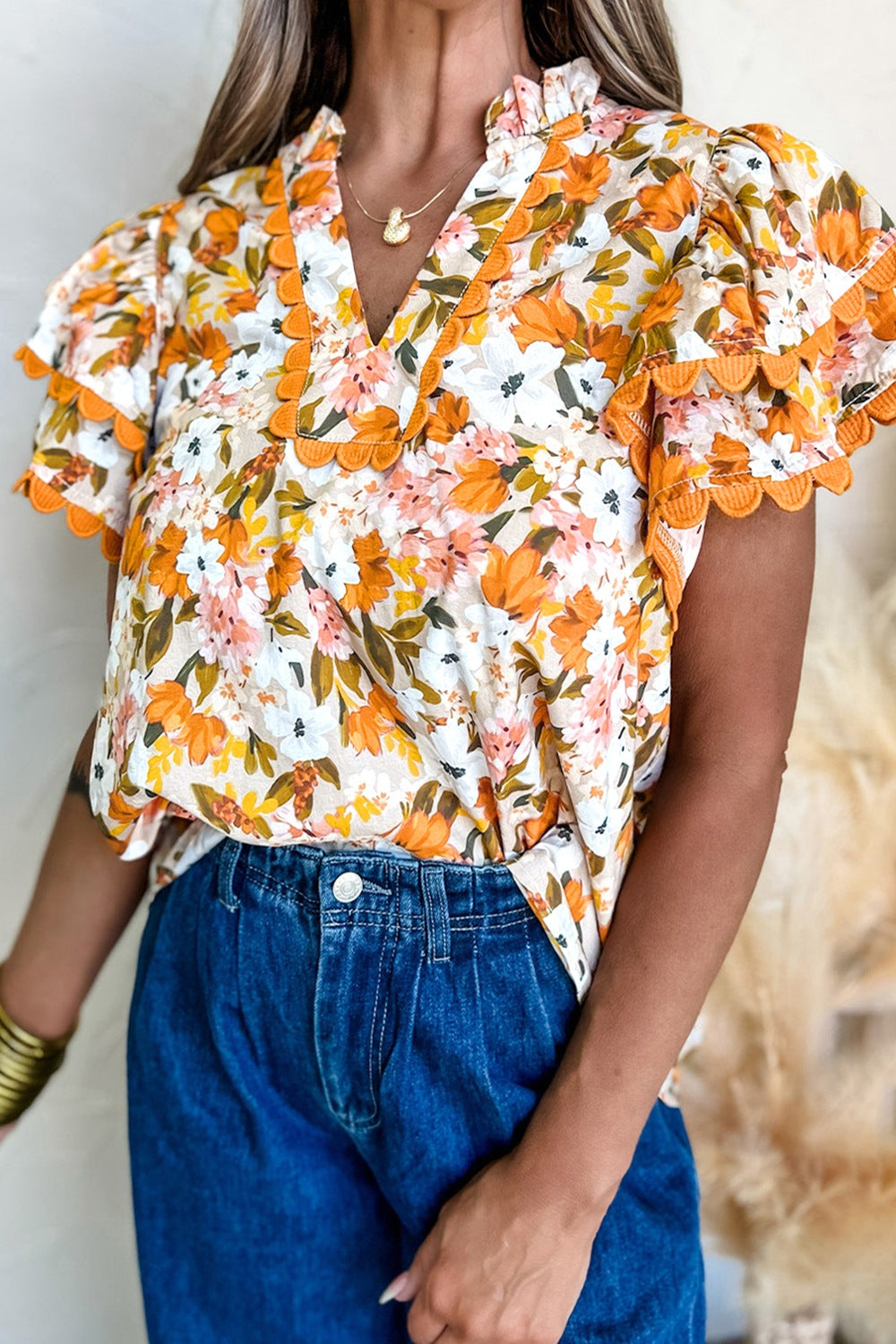 Ruffled Notched Short Sleeve Floral Blouse.