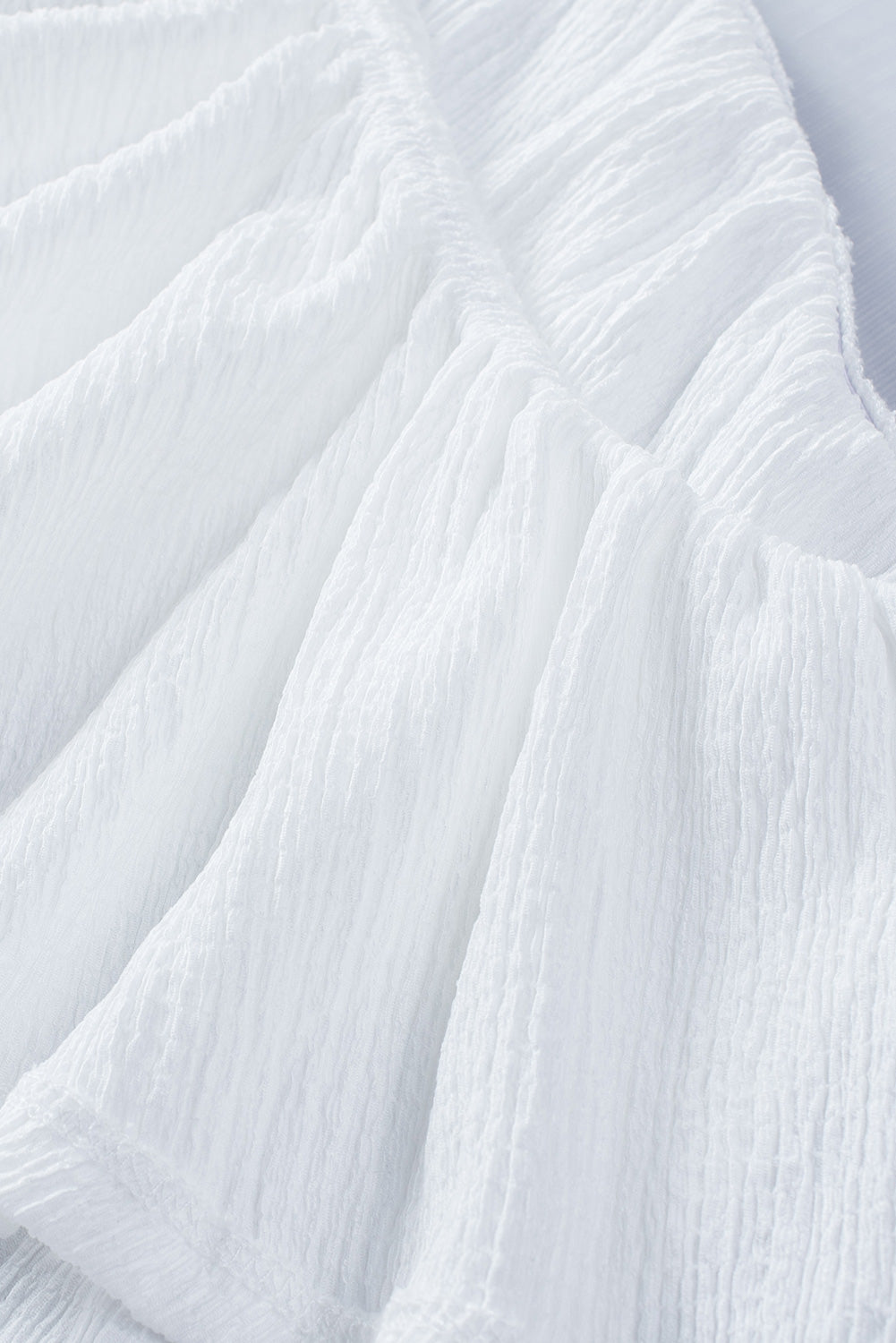 Ruffled one-shoulder tank top.