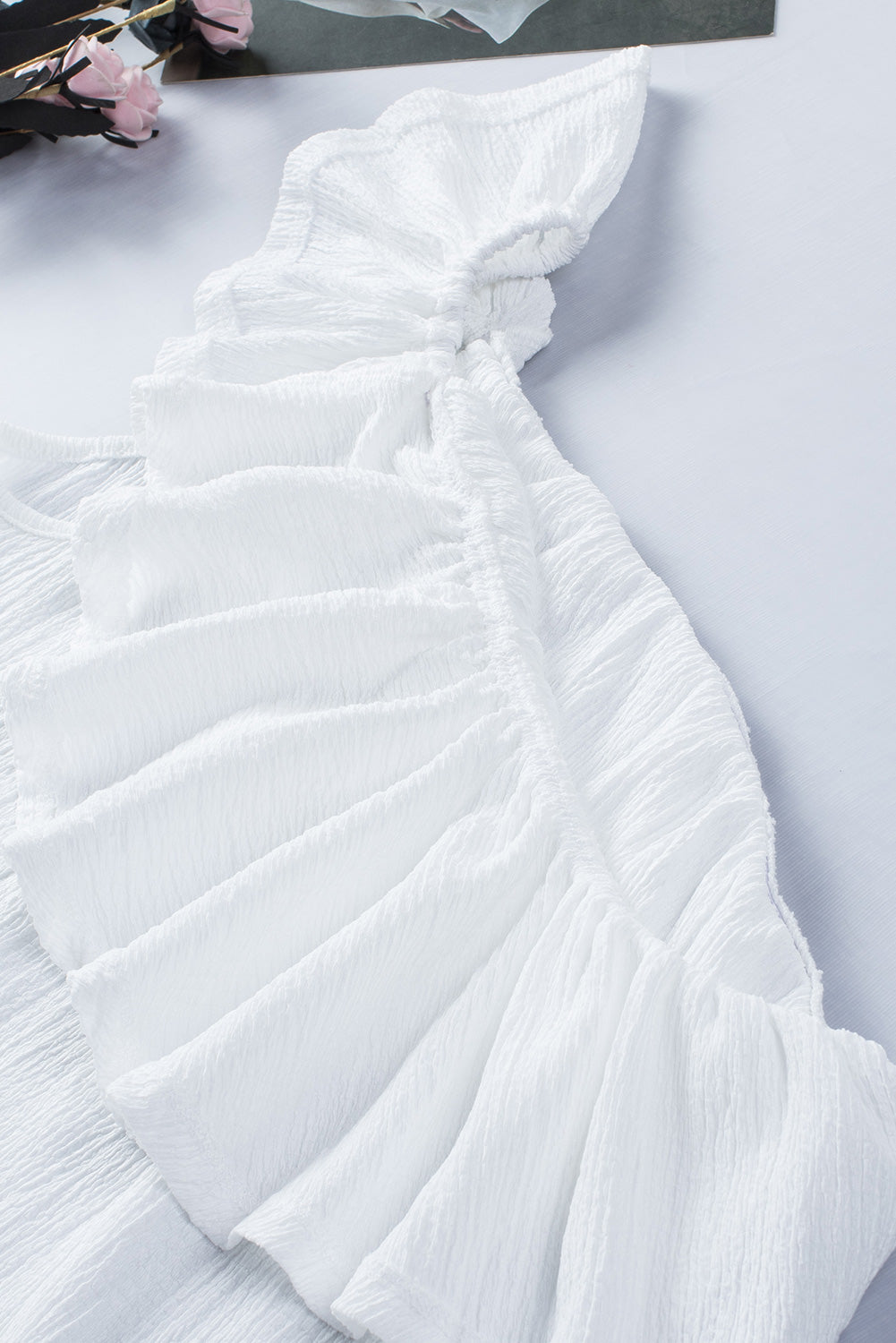 Ruffled one-shoulder tank top.