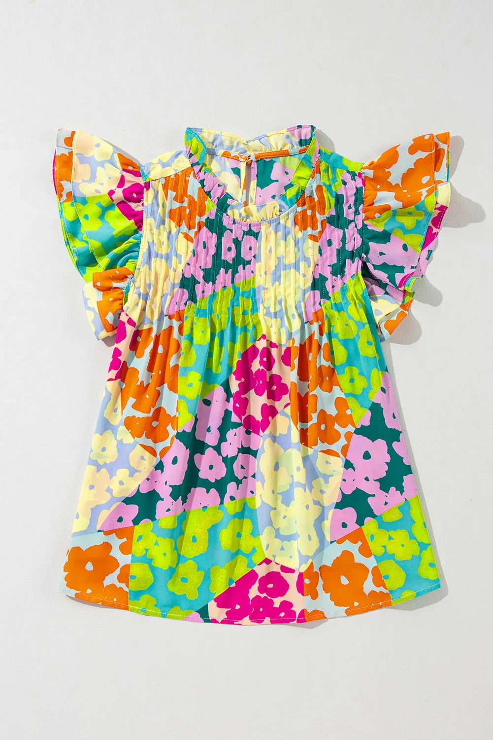 Ruffled Printed Mock Neck Cap Sleeve Blouse.