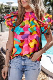 Ruffled Printed Mock Neck Cap Sleeve Blouse.