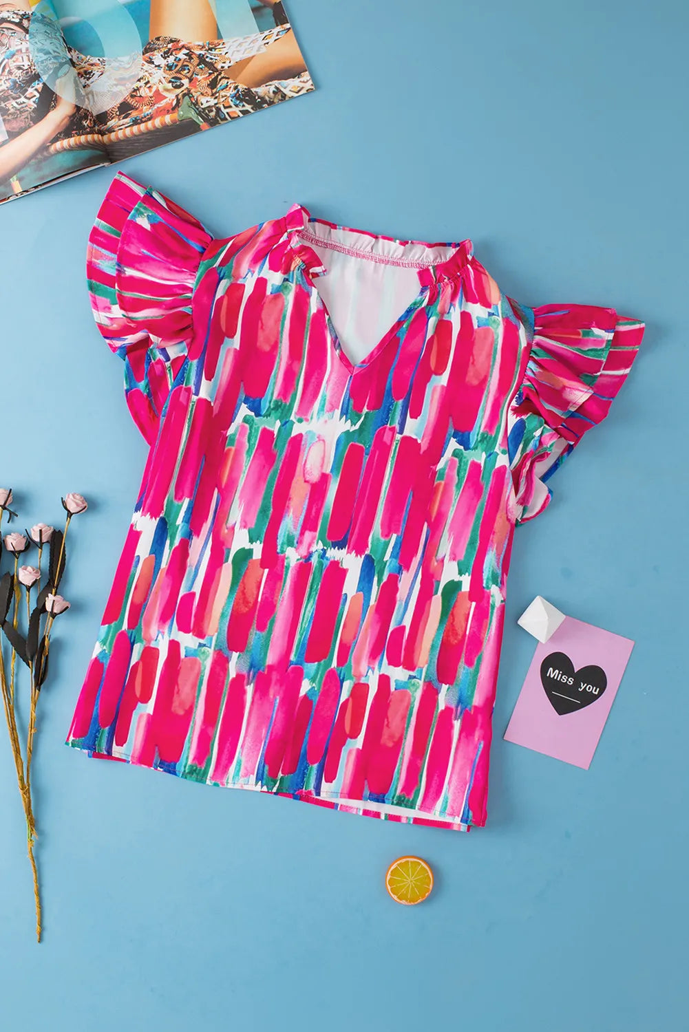 Ruffled Printed Notched Cap Sleeve Blouse.