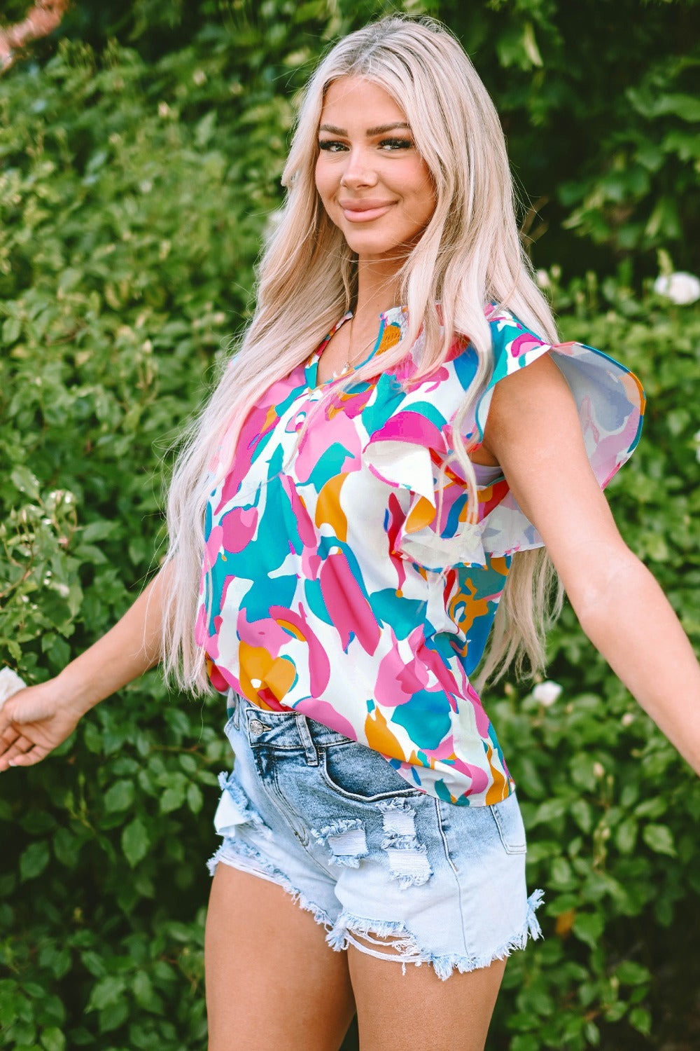 Ruffled Printed Notched Cap Sleeve Blouse.