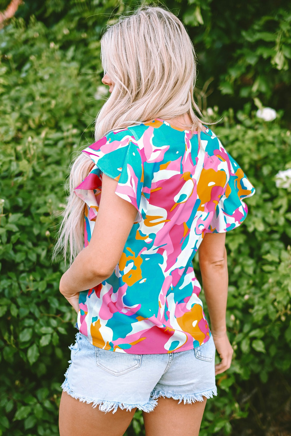 Ruffled Printed Notched Cap Sleeve Blouse.