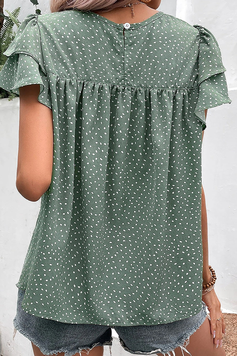 Ruffled Printed Round Neck Cap Sleeve Blouse.