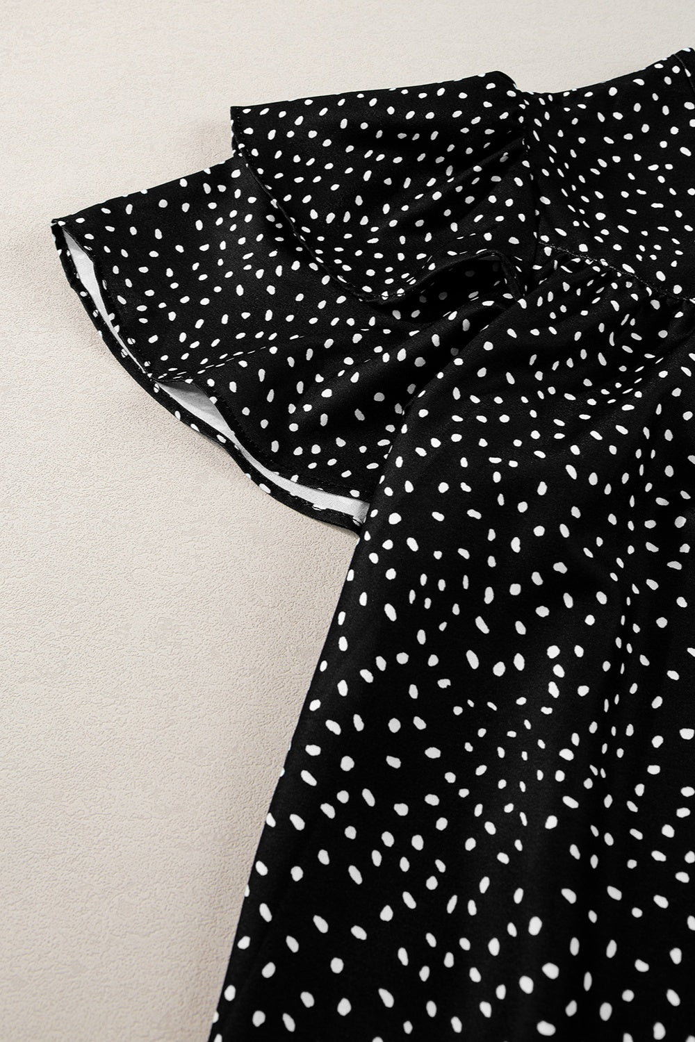 Ruffled Printed Round Neck Cap Sleeve Blouse.