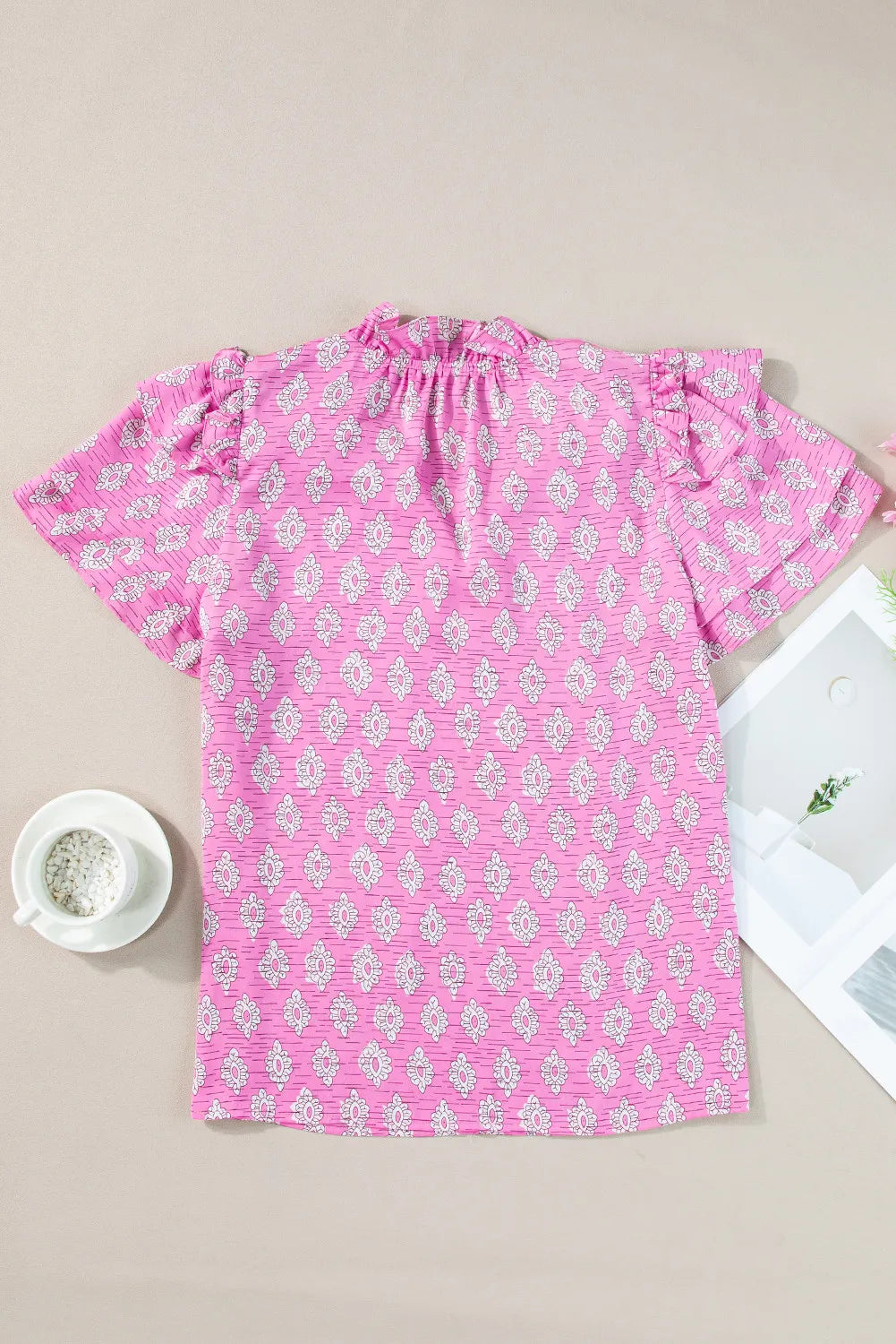 Ruffled Printed Tie Neck Short Sleeve Blouse.