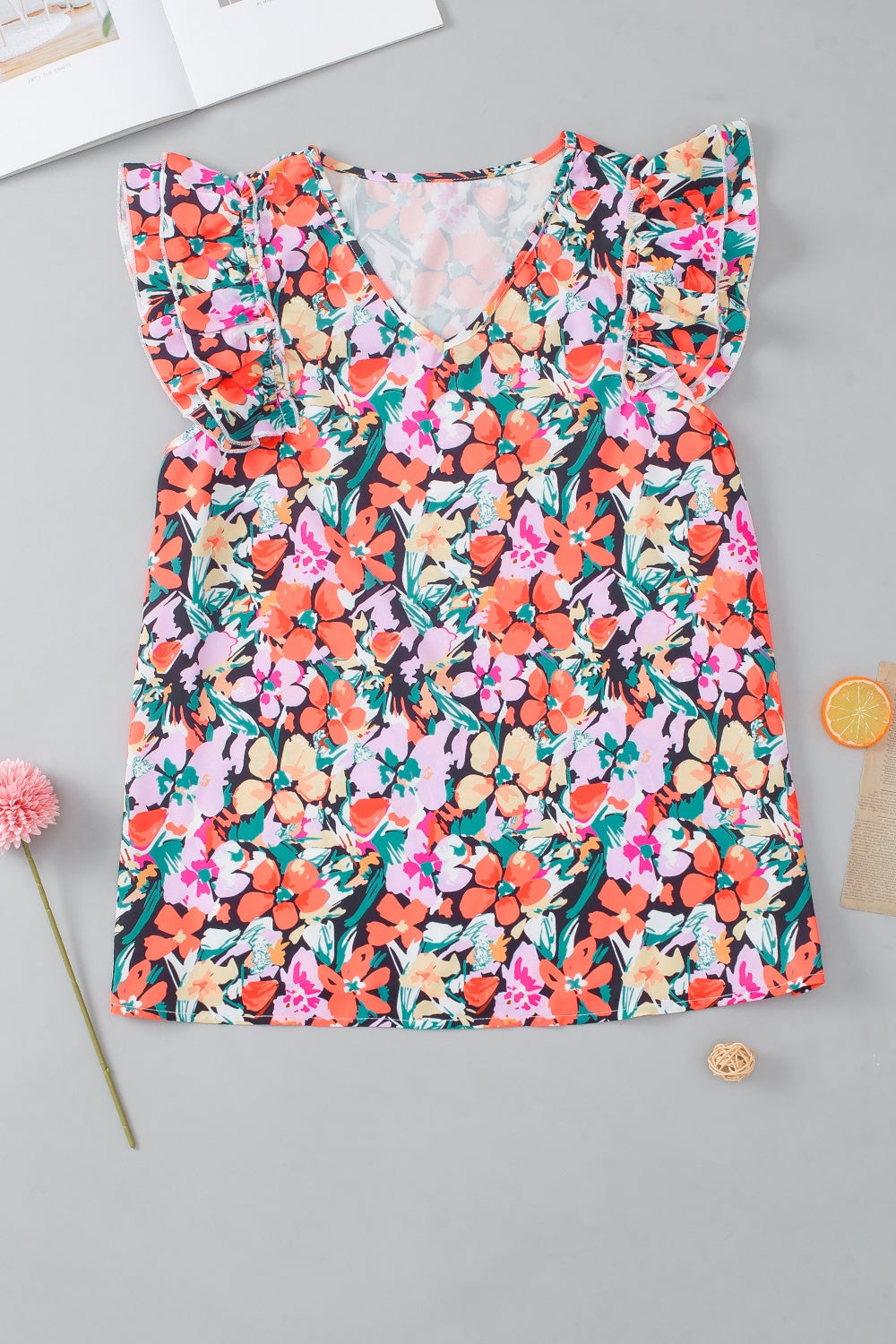 Ruffled Printed V-Neck Cap Sleeve Blouse.