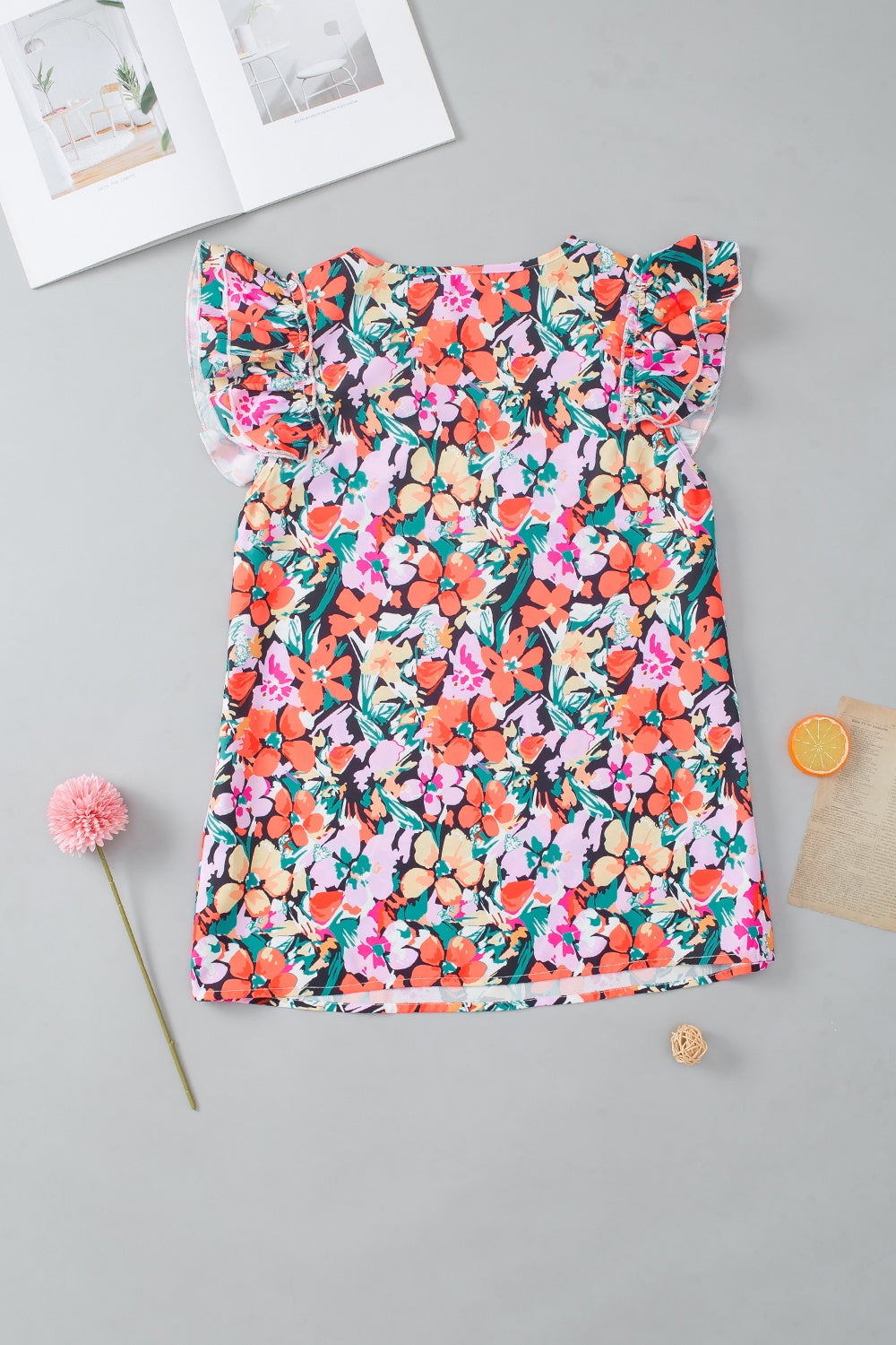 Ruffled Printed V-Neck Cap Sleeve Blouse.