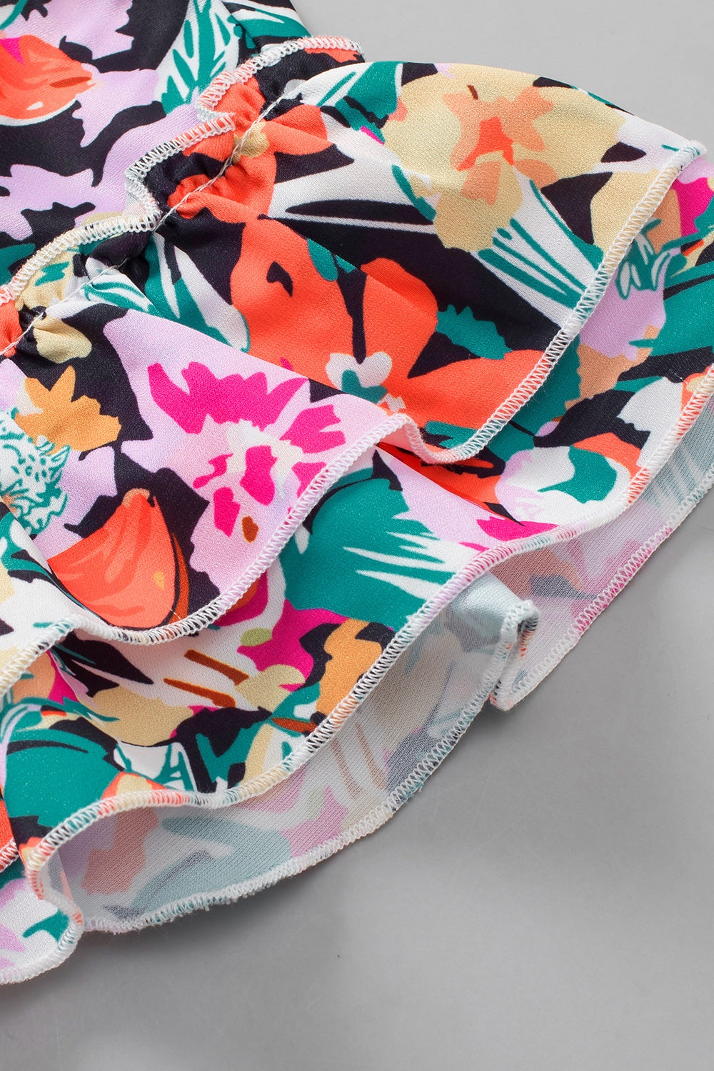 Ruffled Printed V-Neck Cap Sleeve Blouse.