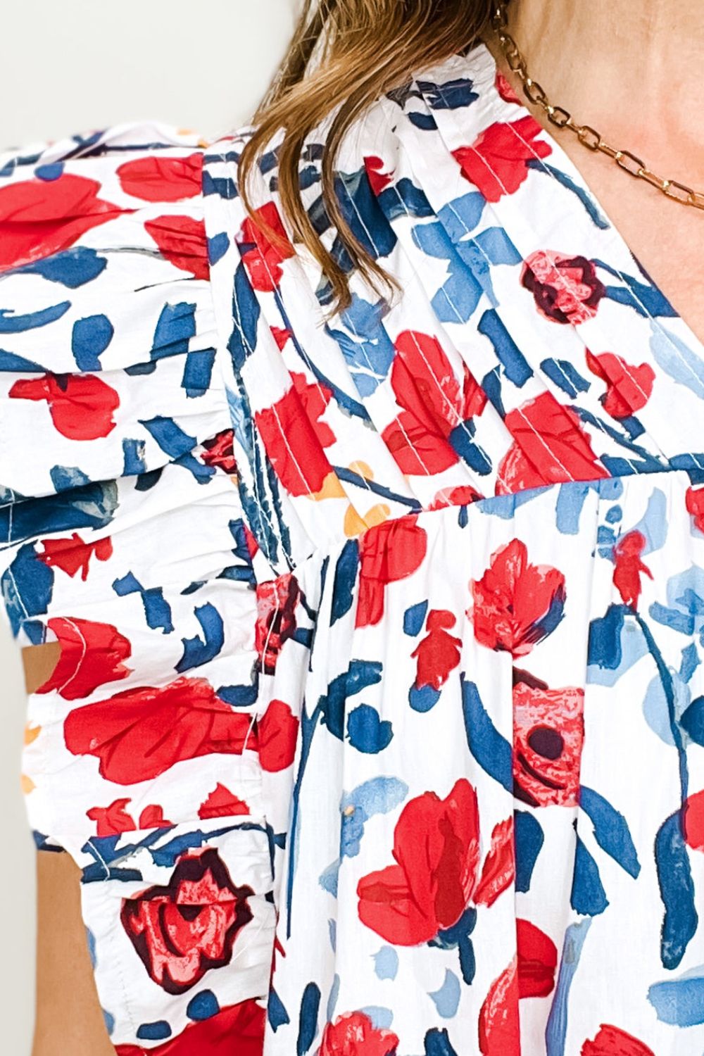 Ruffled Printed V-Neck Cap Sleeve Blouse.