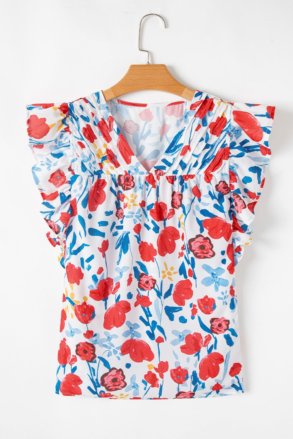 Ruffled Printed V-Neck Cap Sleeve Blouse.