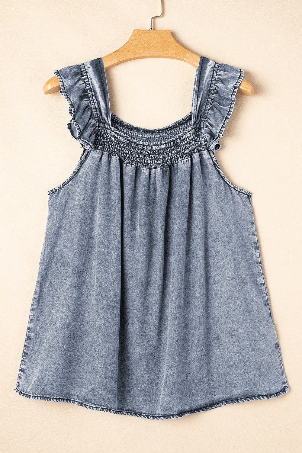 Ruffled shirred denim top.