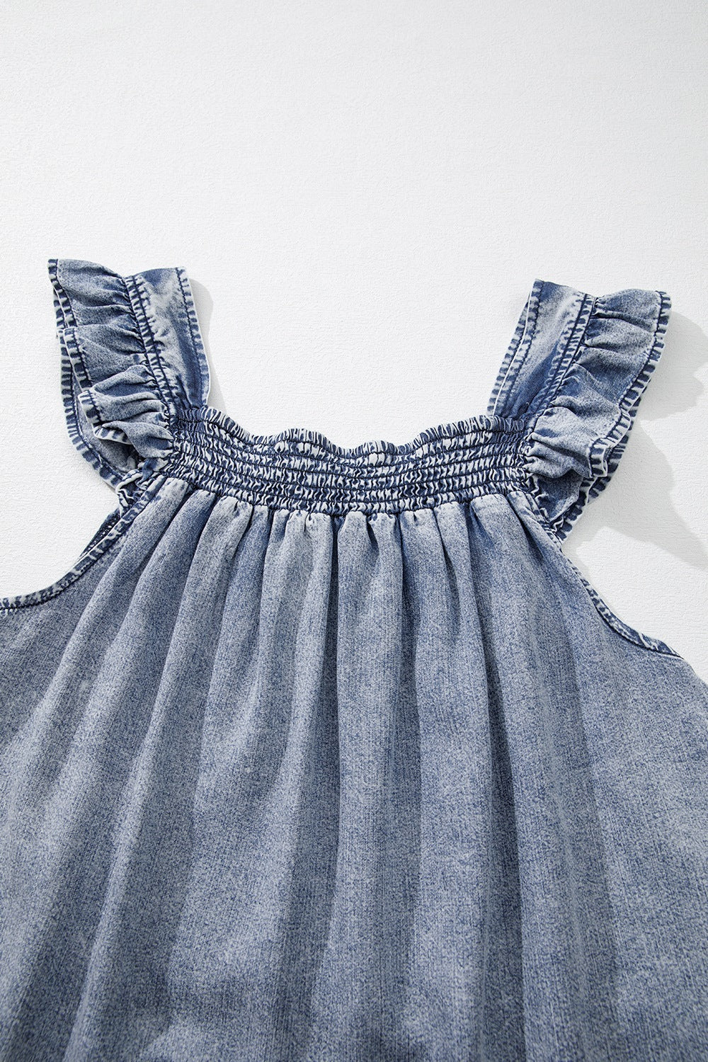 Ruffled shirred denim top.