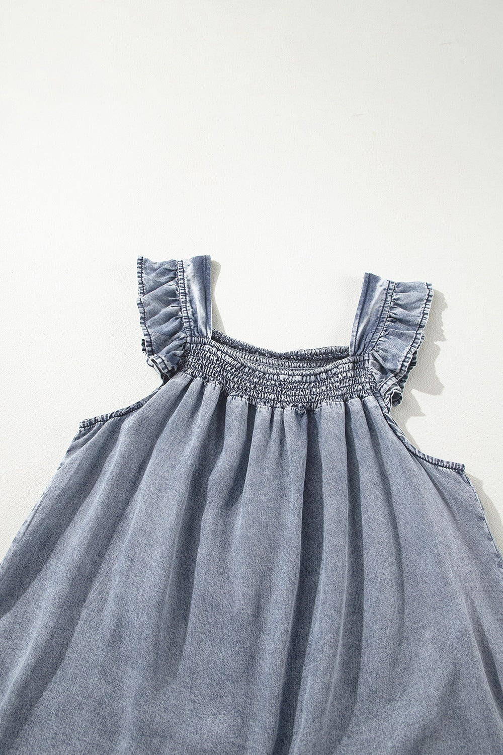 Ruffled shirred denim top.