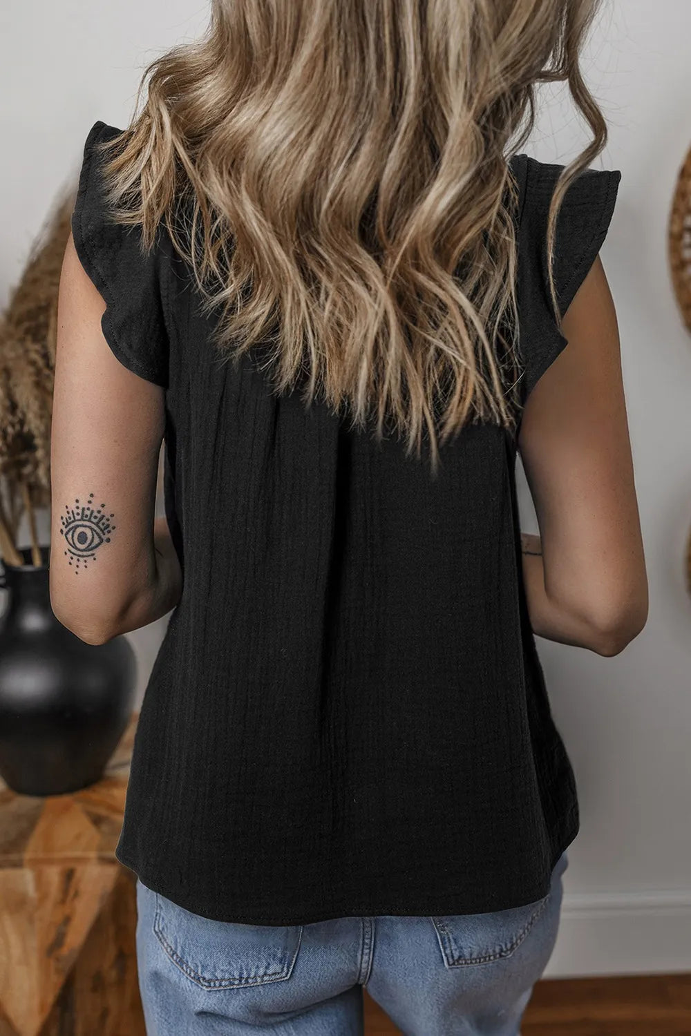 Ruffled shoulder notched shift tank top.