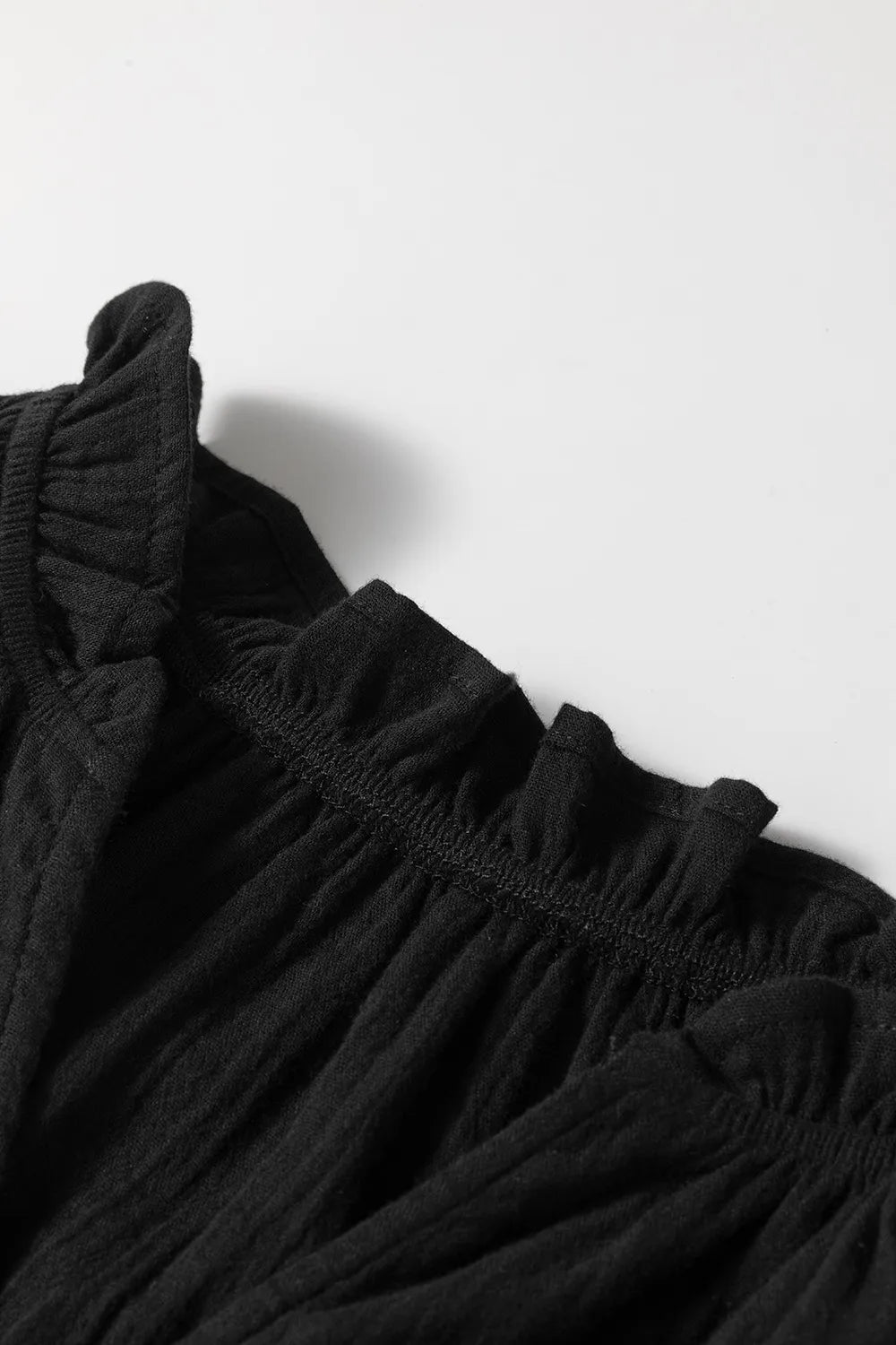 Ruffled shoulder notched shift tank top.