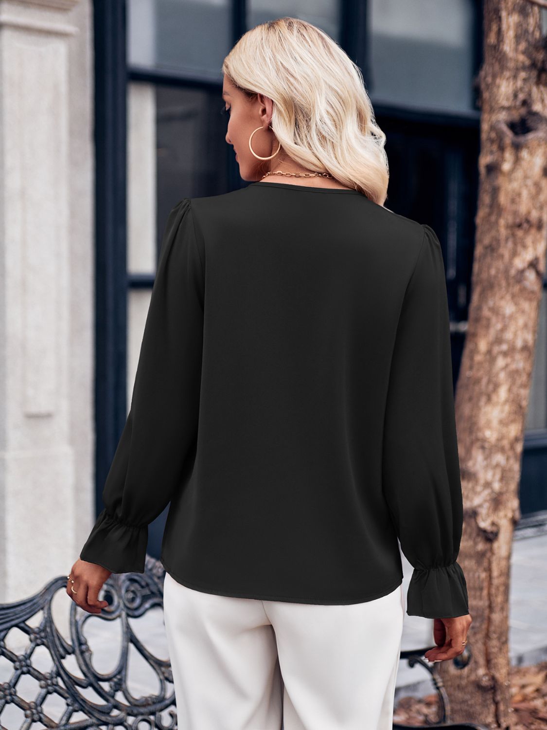 Ruffled V-Neck Flounce Sleeve Blouse with Lace Detail.