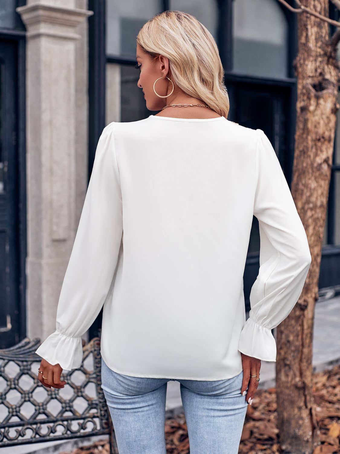 Ruffled V-Neck Flounce Sleeve Blouse with Lace Detail.