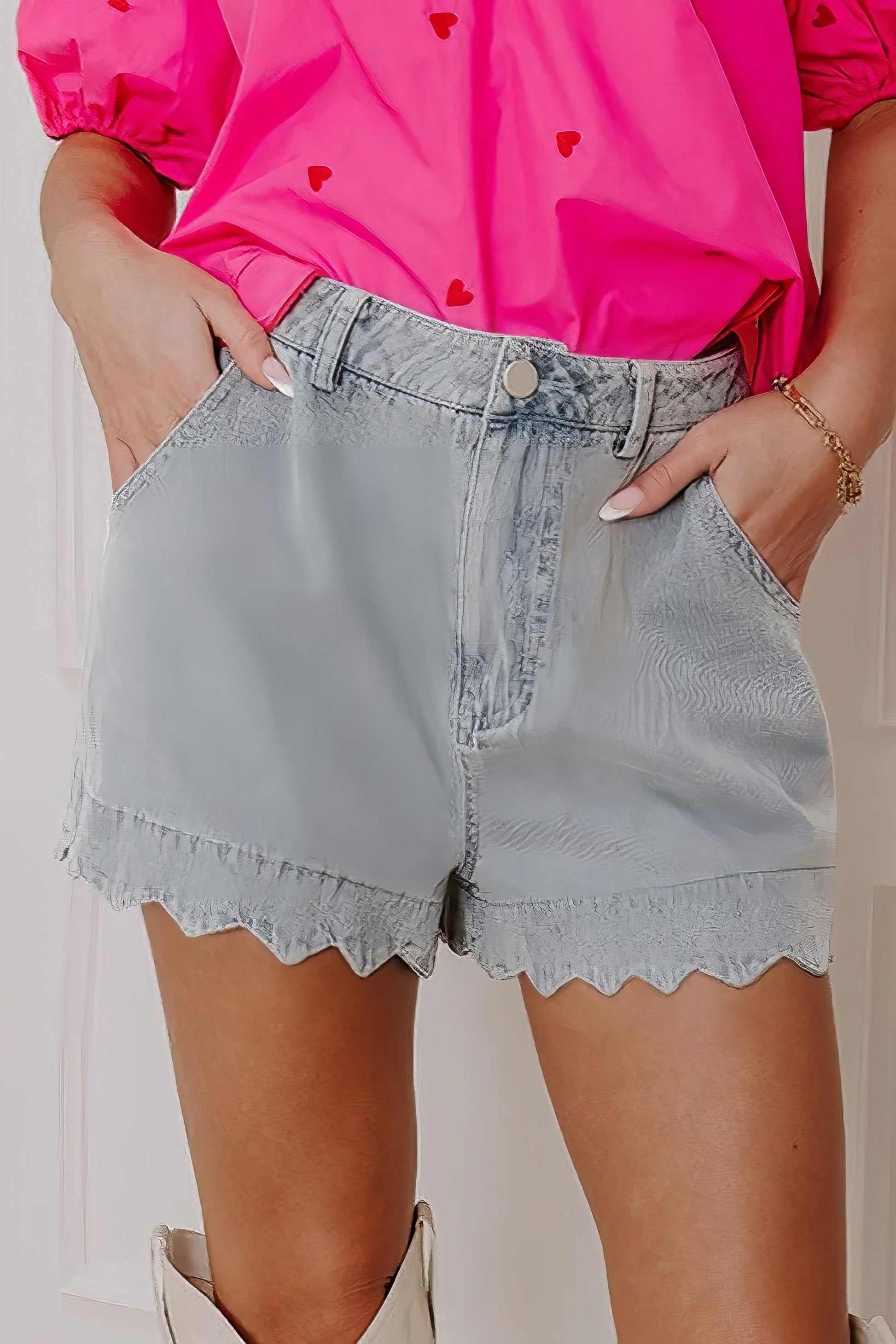 Scalloped hem denim shorts.