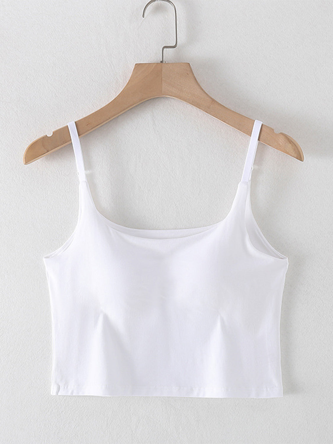 Scoop neck cropped cami with chest pads, opaque and highly stretchy.