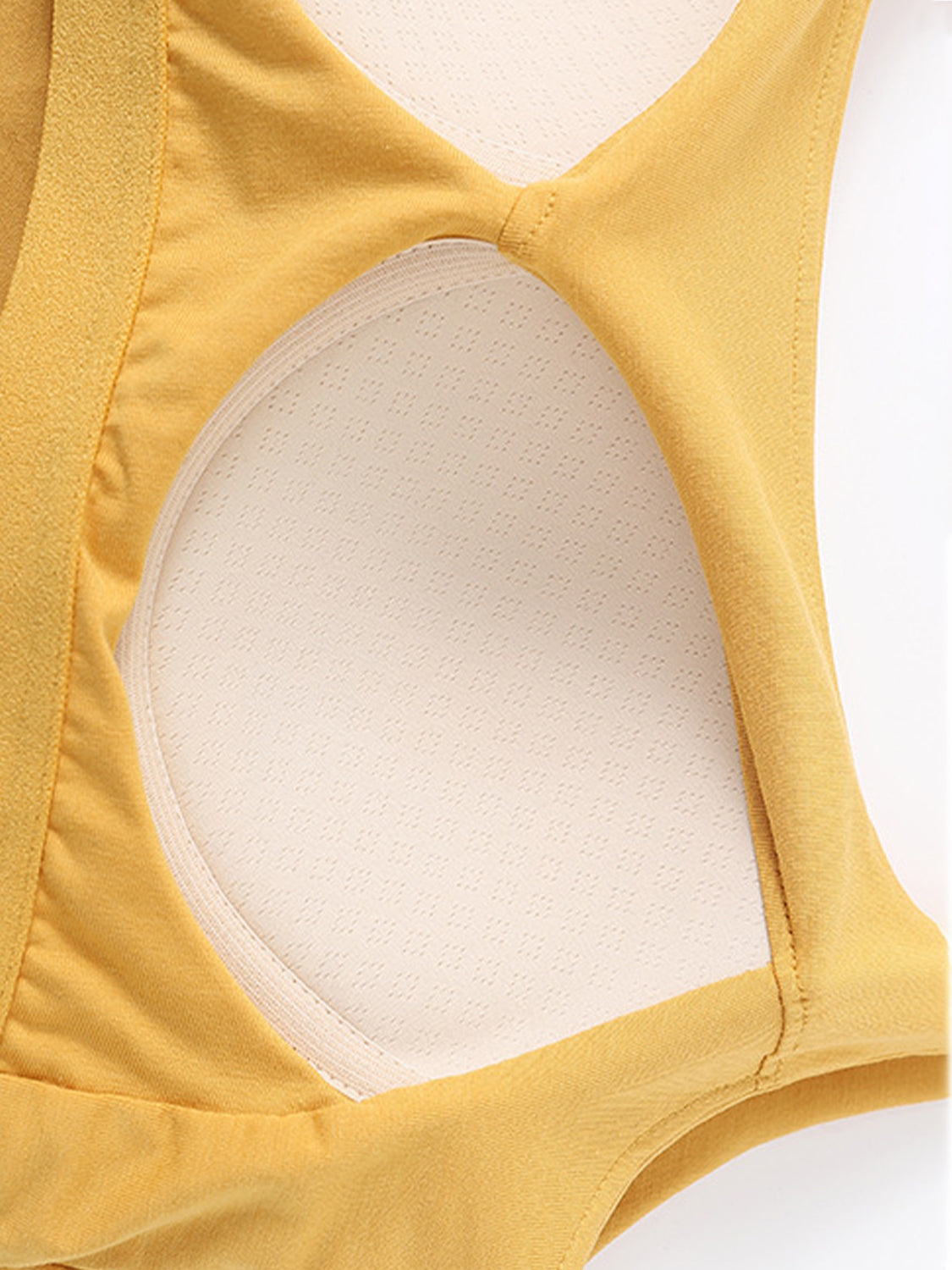 Scoop neck cropped cami with chest pads, opaque and highly stretchy.
