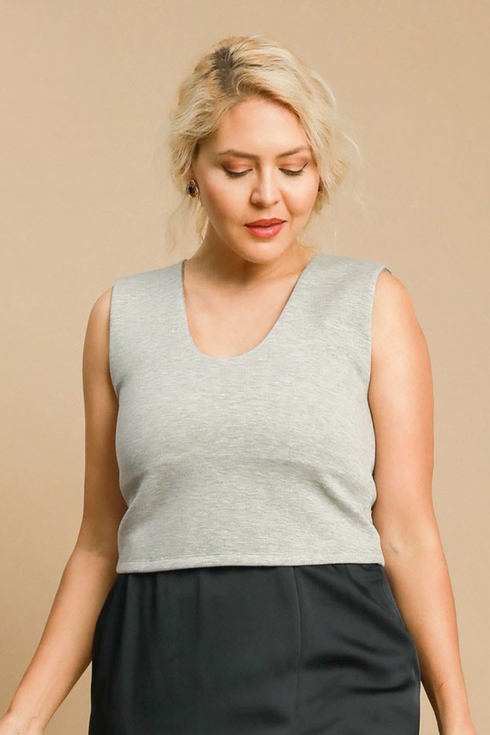 Plus size scoop neck cropped tank, opaque and slightly stretchy.