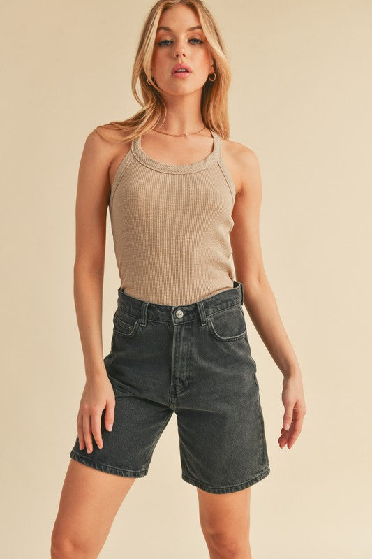 Scoop neck ribbed tank, opaque and slightly stretchy.