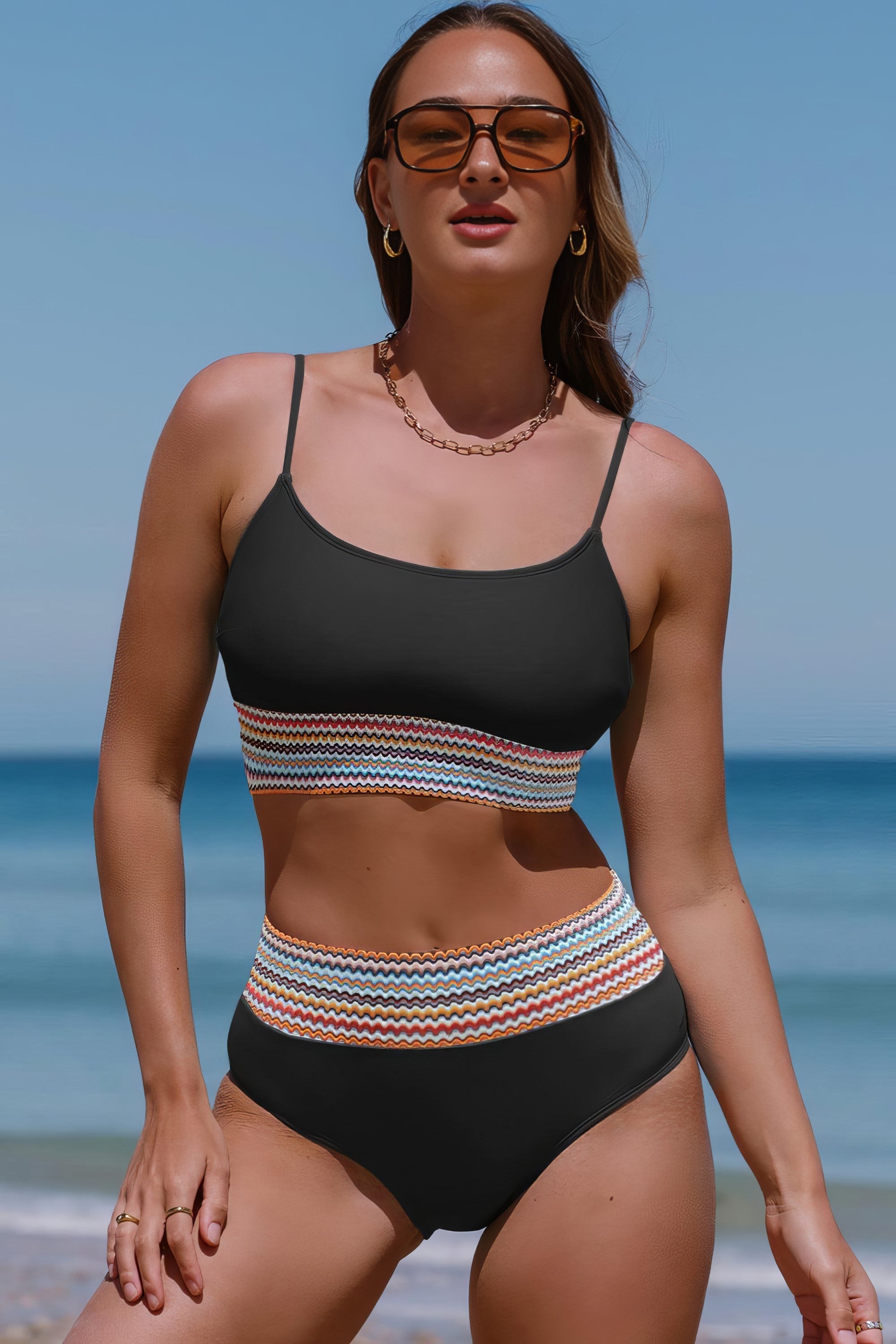 Scoop neck spaghetti strap two-piece swim set with removable padding.