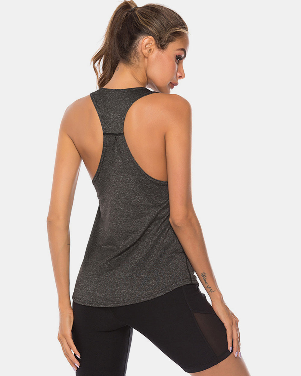 Full size scoop neck wide strap active tank, opaque and moderately stretchy.