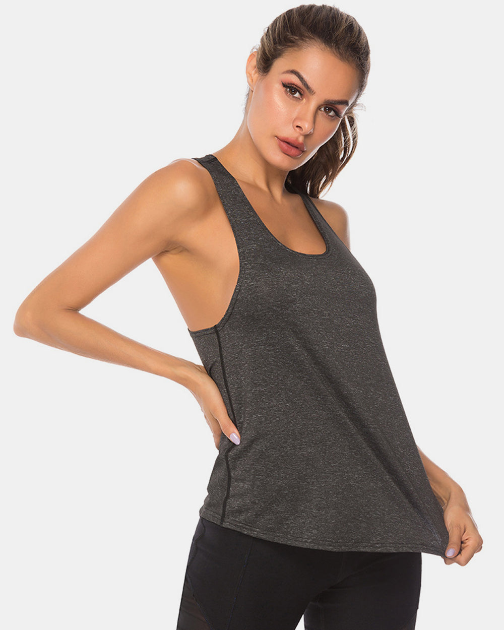 Full size scoop neck wide strap active tank, opaque and moderately stretchy.