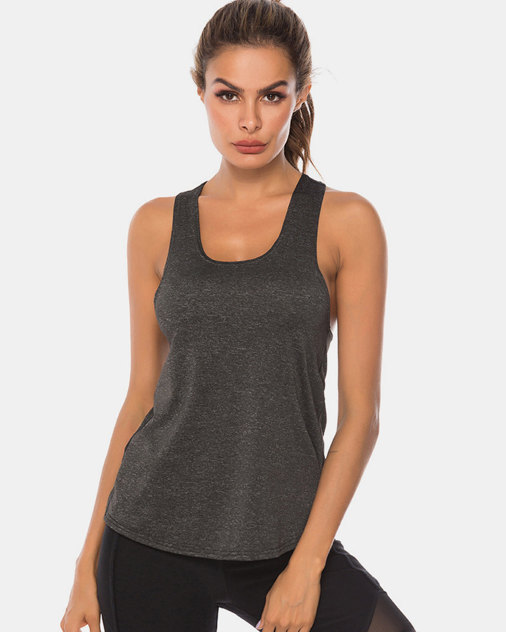 Full size scoop neck wide strap active tank, opaque and moderately stretchy.