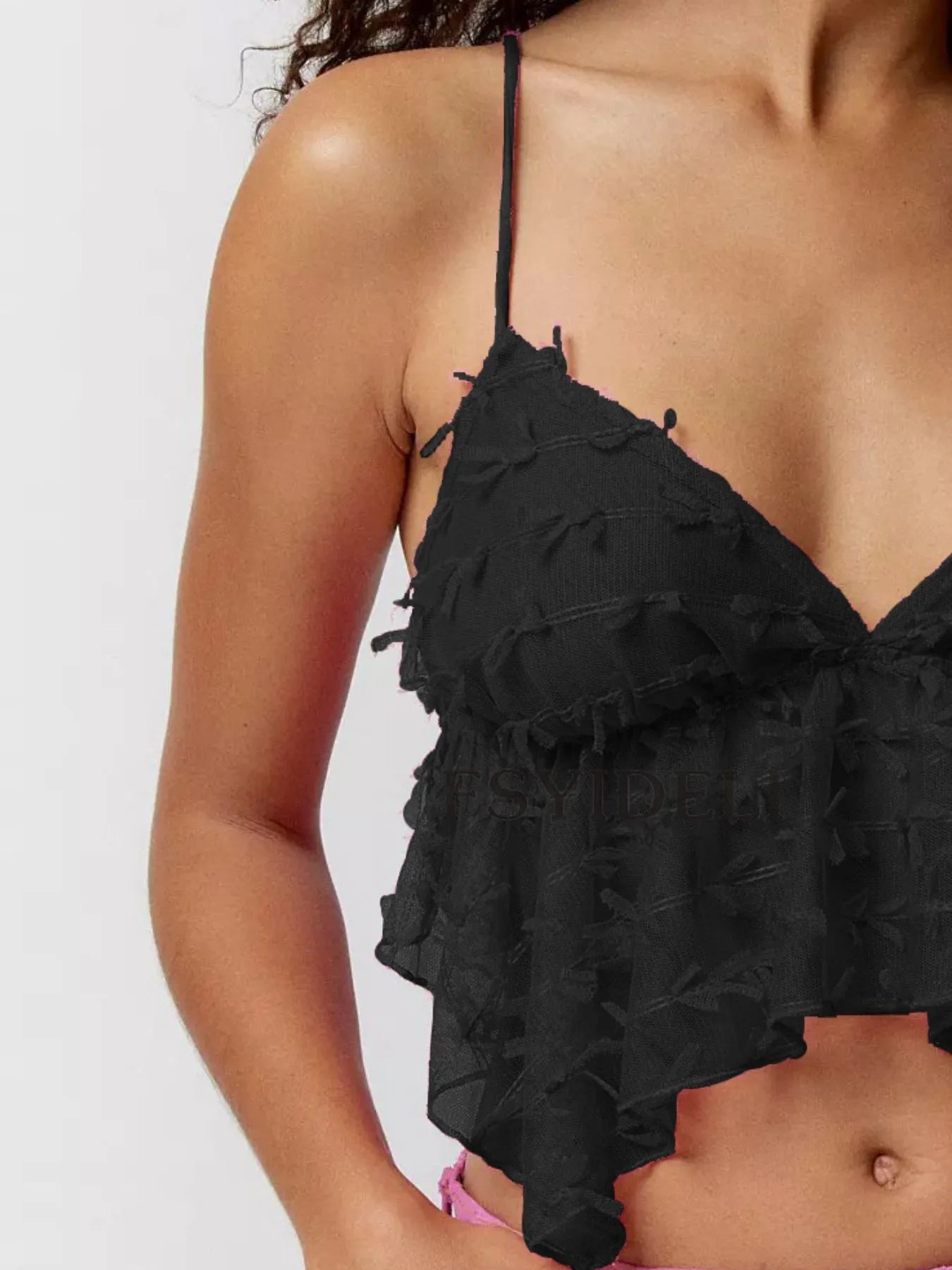 Sheer lace cami top with delicate trim and tie detail.