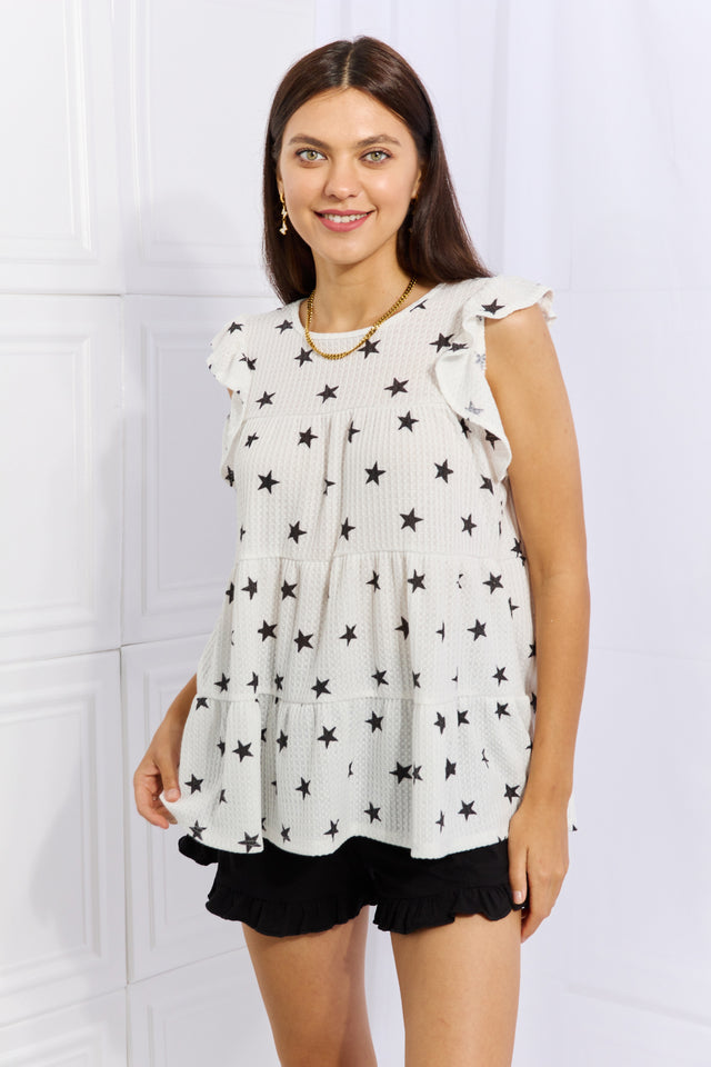Sequin cropped cami with V-neck and spaghetti straps, slightly stretchy.
