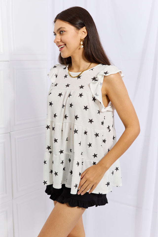 Sequin cropped cami with V-neck and spaghetti straps, slightly stretchy.