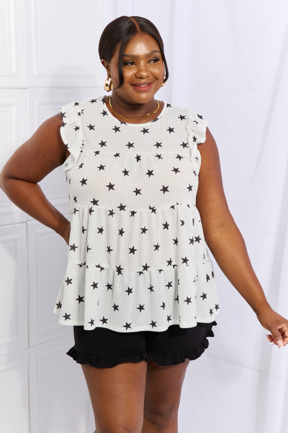 Sequin cropped cami with V-neck and spaghetti straps, slightly stretchy.