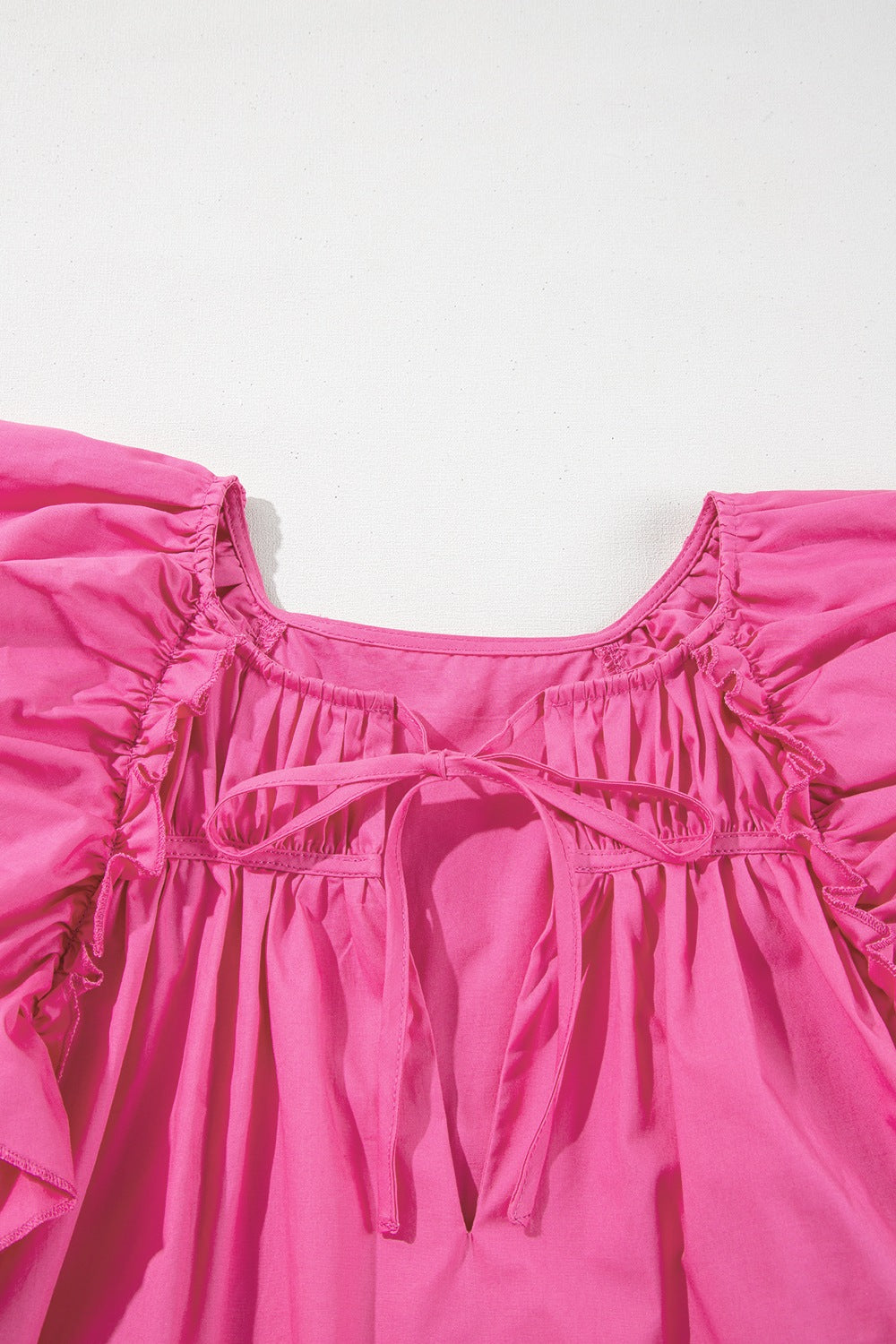 Shirred Tie Neck Ruffled Cap Sleeve Blouse.