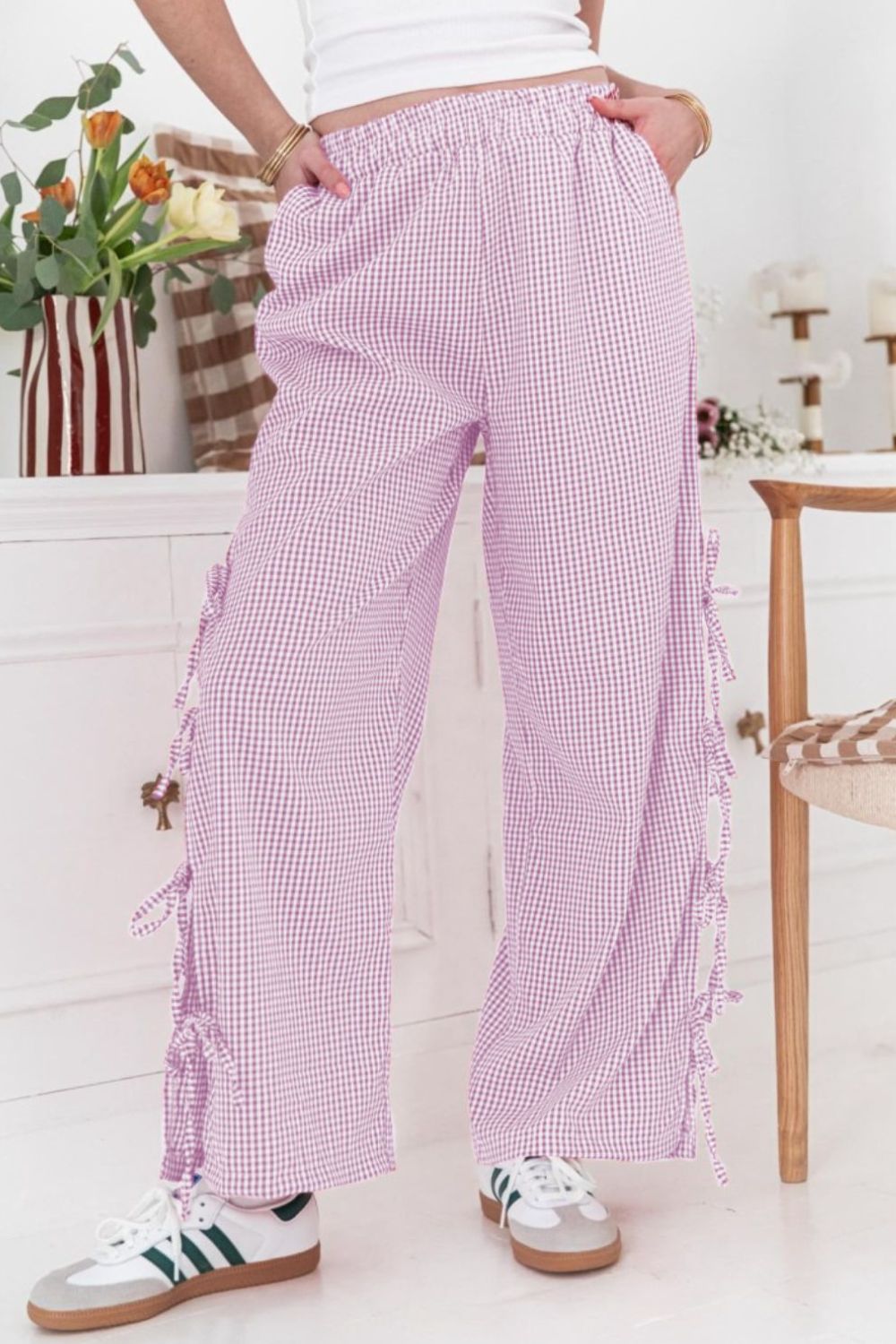 Side tied pants with pockets and slit, opaque.