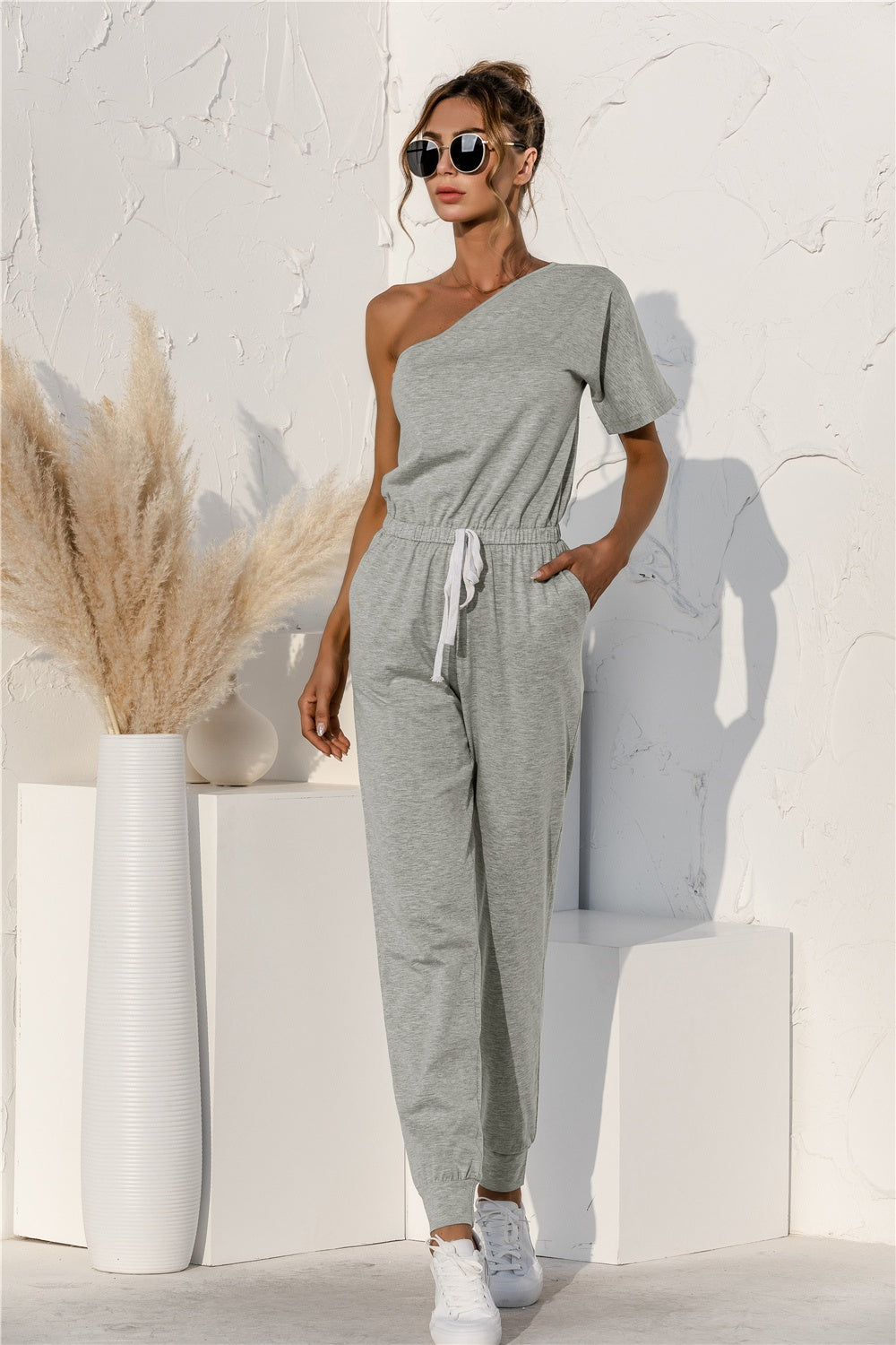 V-Neck Sleeveless Romper with Buttons and Pockets.