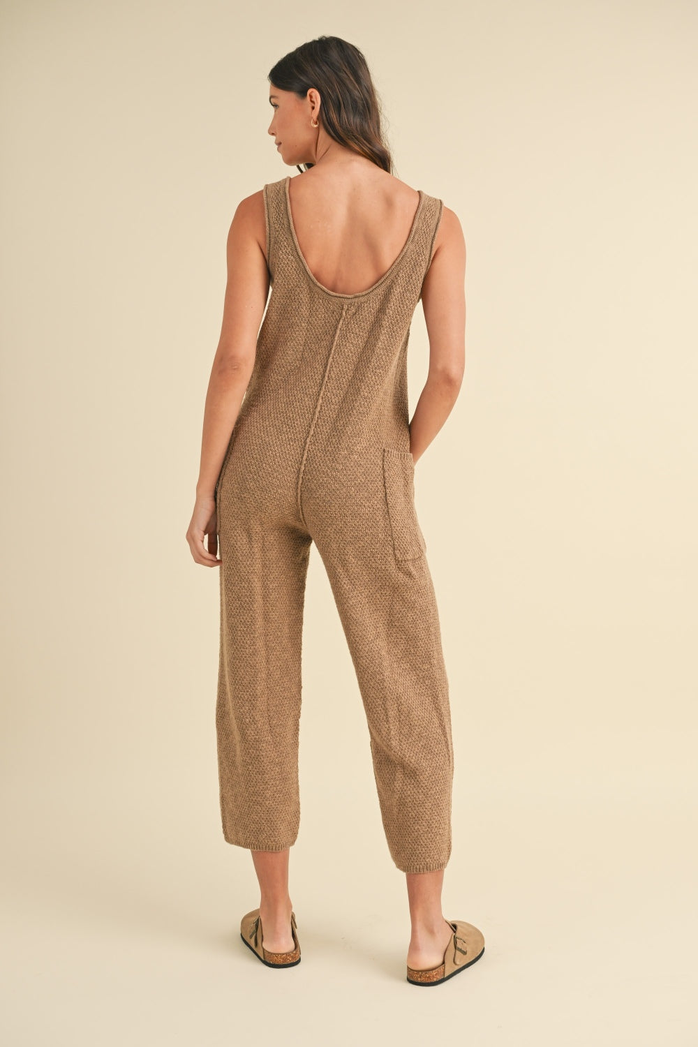 Sleeveless Knit Crop Jumpsuit with Pockets and Exposed Seam.