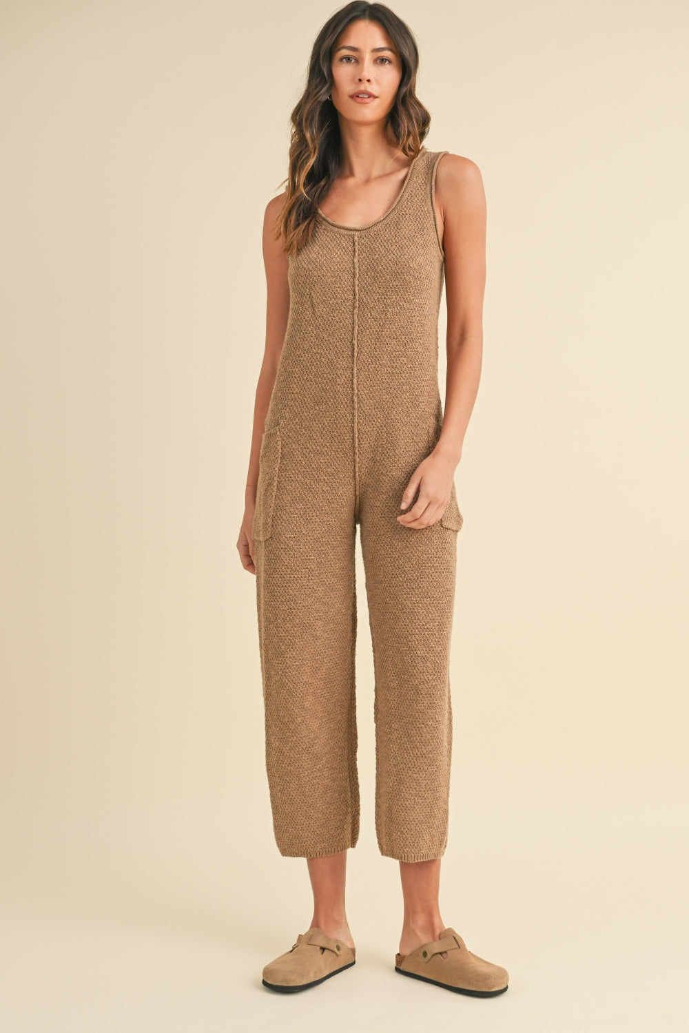 Sleeveless Knit Crop Jumpsuit with Pockets and Exposed Seam.
