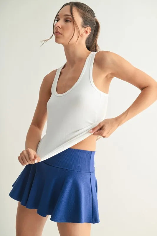 Slim fit scoop neck tank, moderately stretchy.