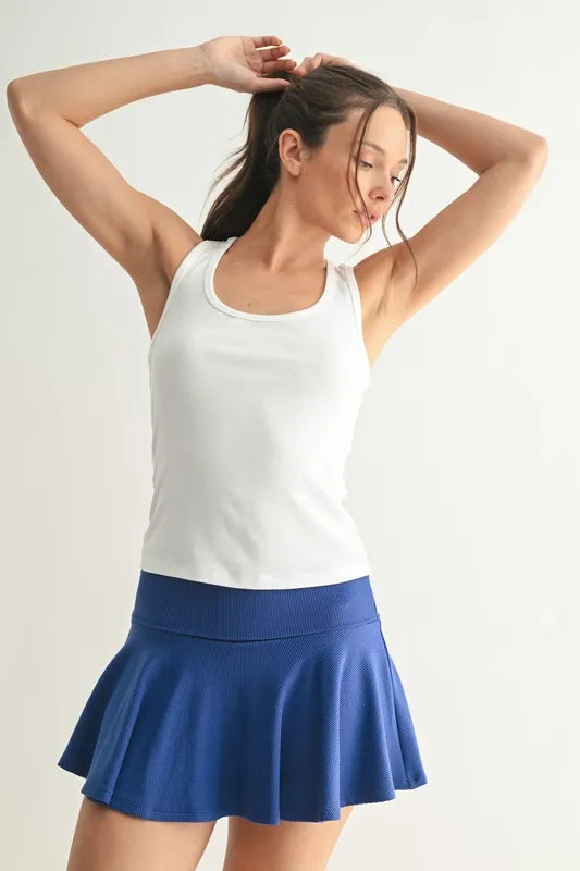 Slim fit scoop neck tank, moderately stretchy.