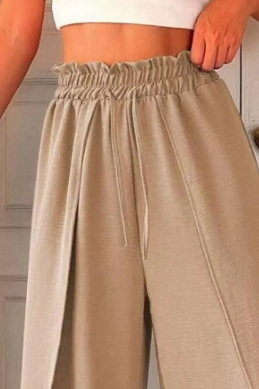 Slit wide leg pants with frill.